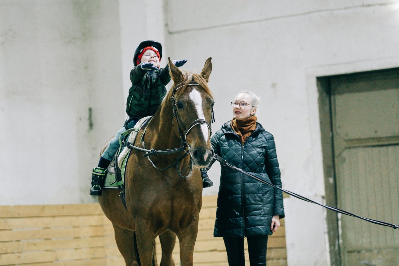 Aleksandr attends hippotherapy lessons